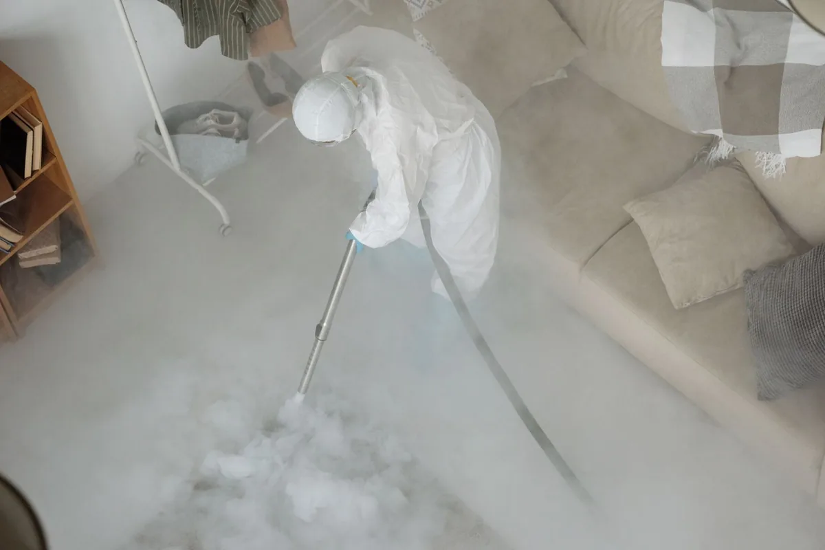 Biohazard cleanup technician in protective equipment, Antigo, WI